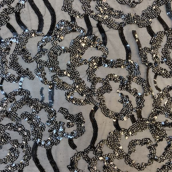Occasion Fabrics Sequinned Black mesh with floral pattern and silver sequins